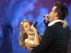 Kylie Minogue l-a invitat pe Robbie Williams la cina in seara de Craciun
