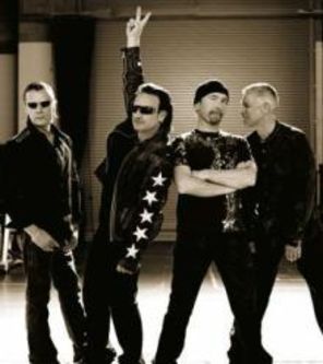 U2, primiti cu proteste in orasul natal